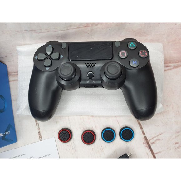 Black Wireless Controller With 4 Extra Grips And Charger Cord